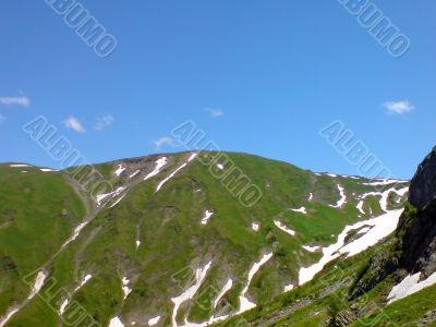 Hill and snow over under bluesky