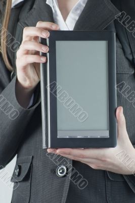 Girl holding an electronic book reader