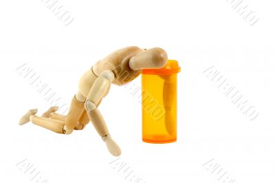 Manikin reaching in pill bottle