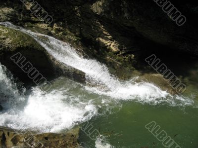 Caucasus waterfalls. Fast stream