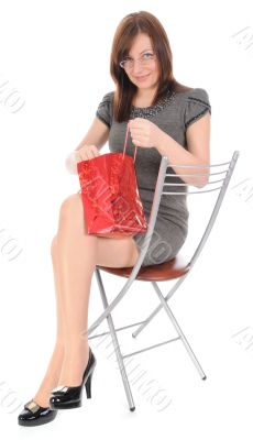 The woman looking in bag.