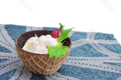 ice cream in chocolate waffle cones at blue napkin