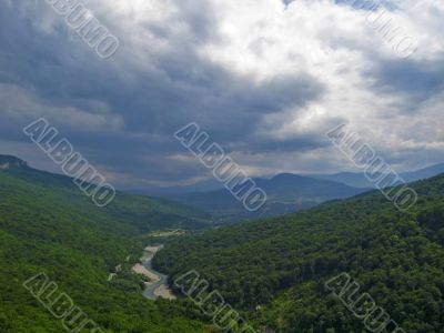 River run away between the hills