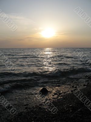 Sun falling into the sea