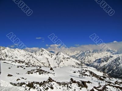 Mountain under the blue sky and the clouds