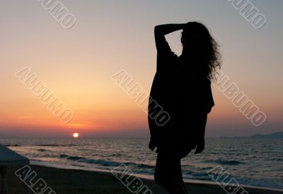 Girl's silhouette on sunset