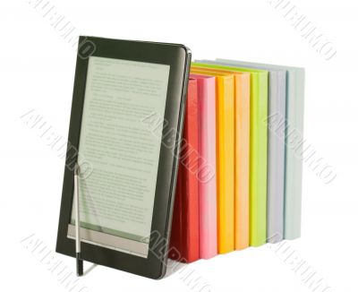 Row of colorful books and electronic book reader