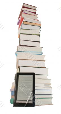 Tall stack of books and e-book reader