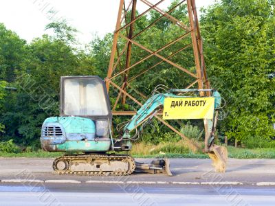 small backhoe on the roadside