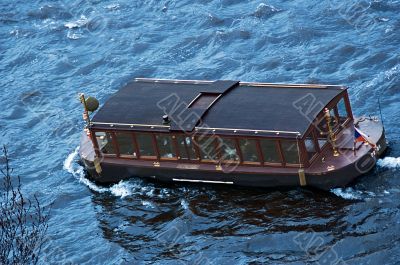 Touristic ship on the river Vltava in Prague
