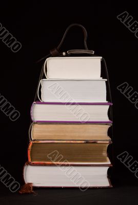 Stack of books on the black background