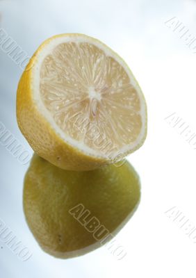Half of a lemon on mirror