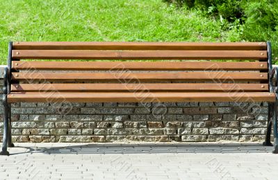 wooden bench in a city park