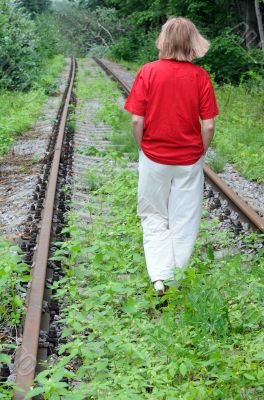 Walking Away Along Abandoned Railroad Track