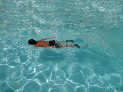 boy swimming underwater