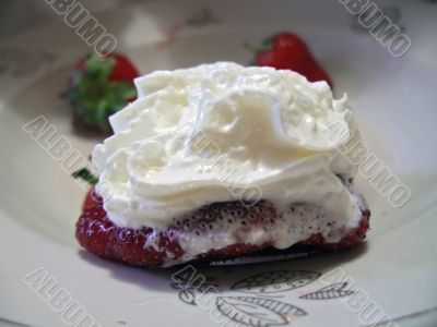 Strawberries and cream on the plate
