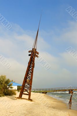 Metal tilted tower on the coast