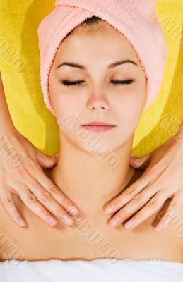 Beautiful young woman receiving massage