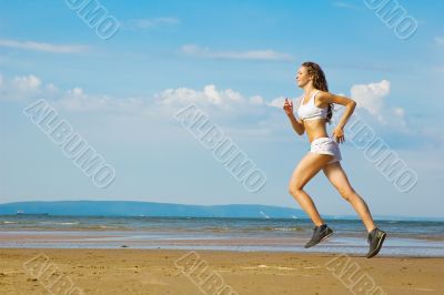 girl running alone on the beach