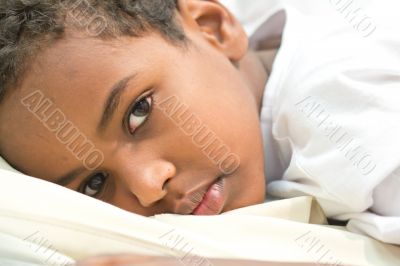 Boy resting in his bed