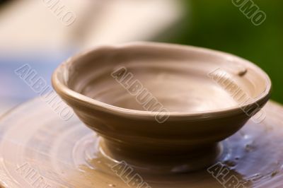 New pot on potter`s wheel