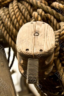 Old rope and wooden block pulleys