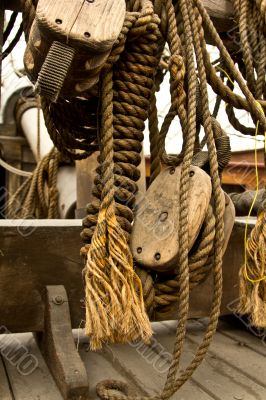 Old rope and wooden block pulleys