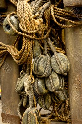 Old rope and wooden block pulleys
