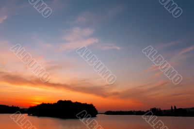 Multicolour cloudscape over reservoir