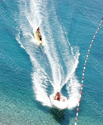 Motor-boat with banana boat water sled