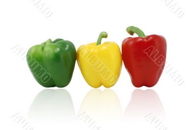 Green, Red And Yellow Capsicum In A Row