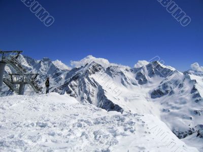 Lonely man and the blue mountains
