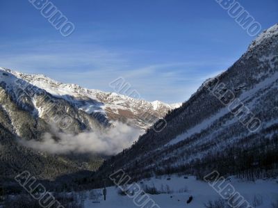 Mountain under the blue sky and the clouds