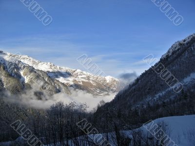 Mountain under the blue sky and the clouds