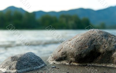 Stones on the mountain river shore