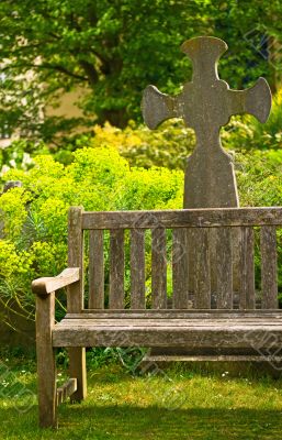 Rustical bench in blossom graveyard