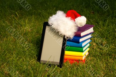Electronic book reader with Santa`s hat