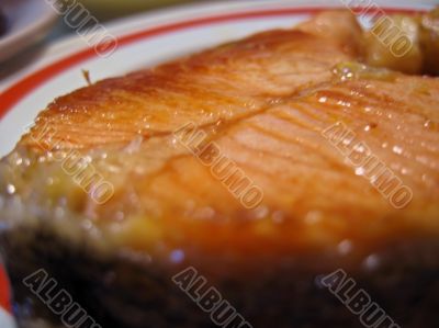 Red fish steak on the plate