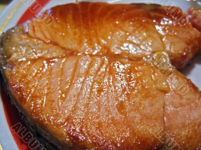 Red fish steak on the plate