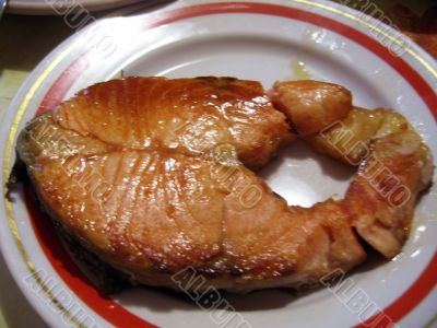 Red fish steak on the plate