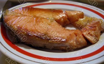 Red fish steak on the plate