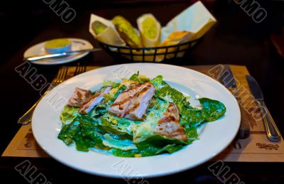 Ceasar salad on served table