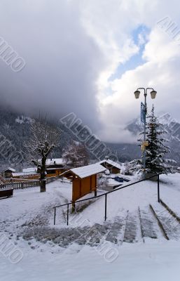 Iced and snowy stair in the alpine town