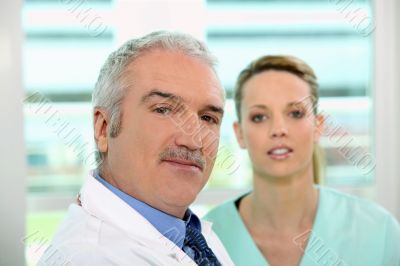 Friendly looking doctor and nurse Friendly looking doctor and nurse