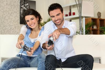 A couple having fun playing video games