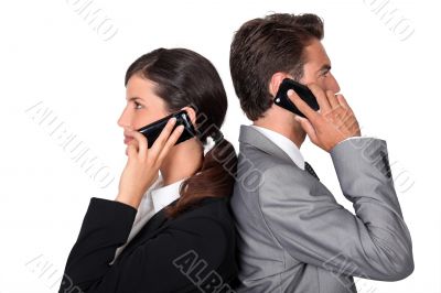 businessman and businesswoman telephoning