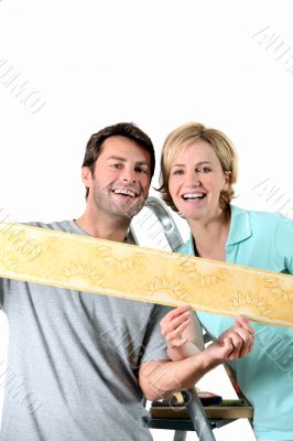 Couple holding colorful wallpaper border