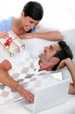 woman making a present to her boyfriend