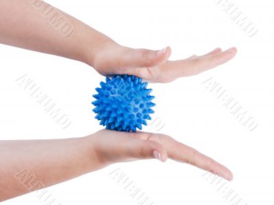 Woman`s hands with massage ball