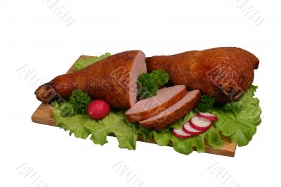 Smoked chicken on wooden board.